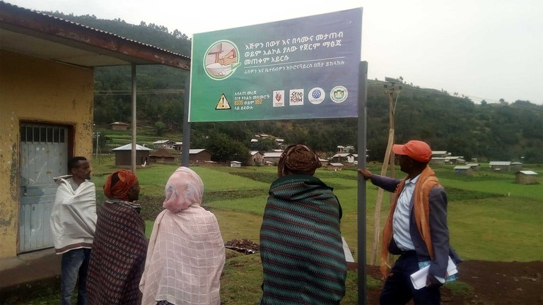 Ministry of Health approved IEC material signboard in a local language. Credit: Send a Cow.