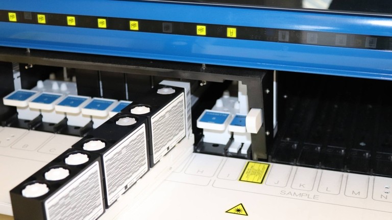 Reagent cassesttes being loaded into biochemistry analyser
