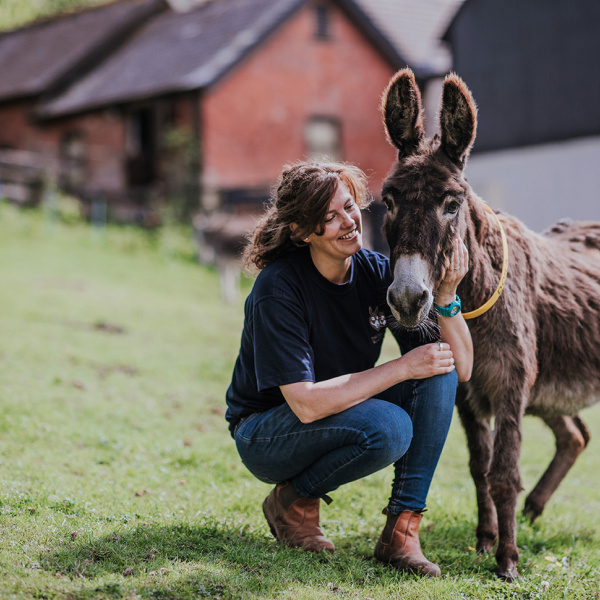 Staff member with a donkey