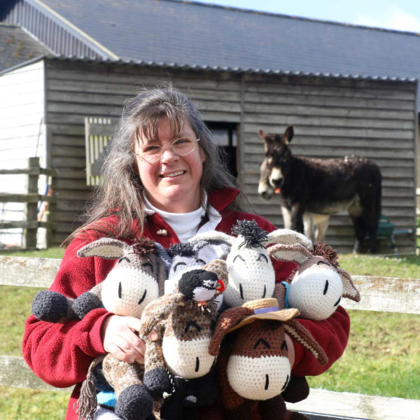 Judith Crockford with lots of Neddies and a donkey in the background