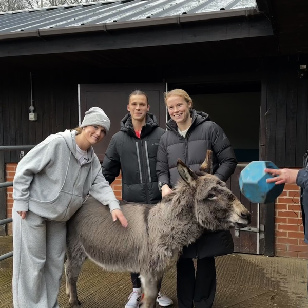 Manchester City players Ruby, Kerstin and Julie with adoption donkey Hector
