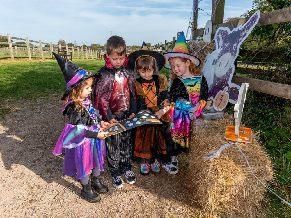 Group of children dressed in halloween costumes for the trail
