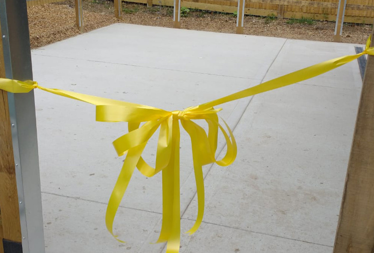 Yellow ribbon used to open the new stables.