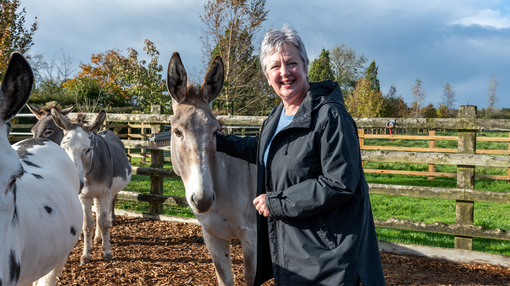 Trustee Vivienne Hole with grey donkey