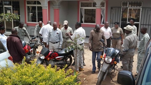 A group of men with their motorbikes ready to patrol the boarders to stop donkey thefts.