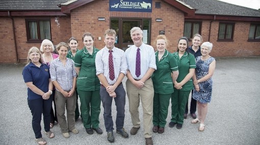 A group of vets and staff outside a veterinary hospital