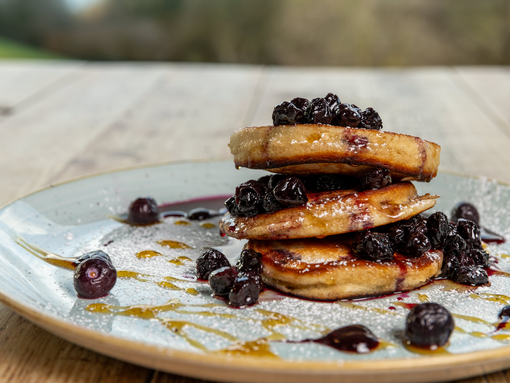 american pancakes with blueberries and maple syrup