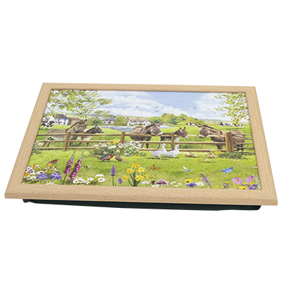 Angled view of Dinner tray featuring meadow scene, complete with five donkeys and other farm animals. MDF and cotton, with bean bag base.