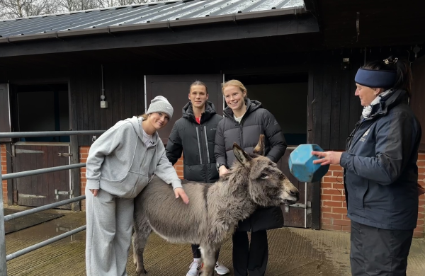 Manchester City players Ruby, Kerstin and Julie with adoption donkey Hector
