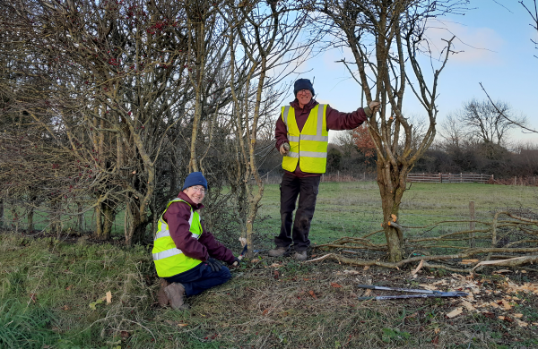 Volunteers Karen and David using traditional conservation methods at Sidmouth