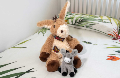 Patch Donkey Toy and Living Nature SMOLS Donkey Toy on bed