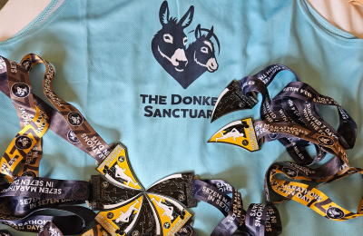 Clive Poole's The Donkey Sanctuary running vest and medals