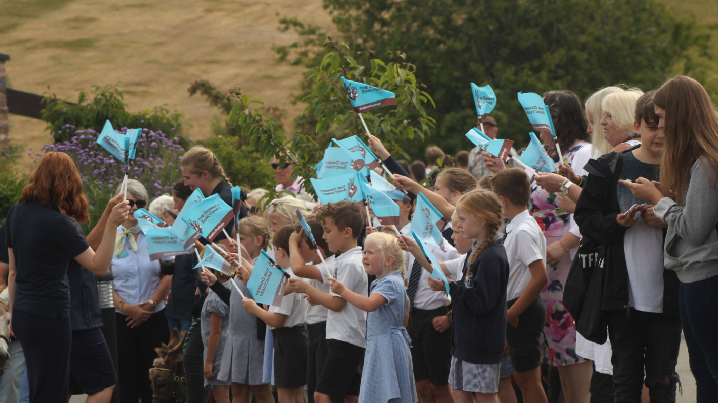 School children from Sidmouth Primary School greet Her Royal Highness.