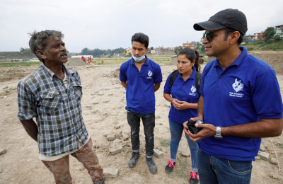 Animal Nepal staff talk with best owner award winner