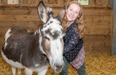 Natalie Cook with a donkey at The Donkey Sanctuary Sidmouth