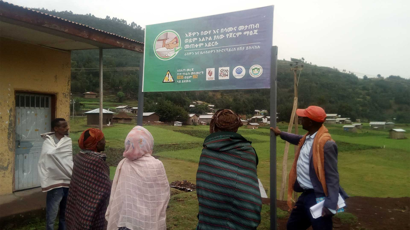 Ministry of Health approved IEC material signboard in a local language. Credit: Send a Cow